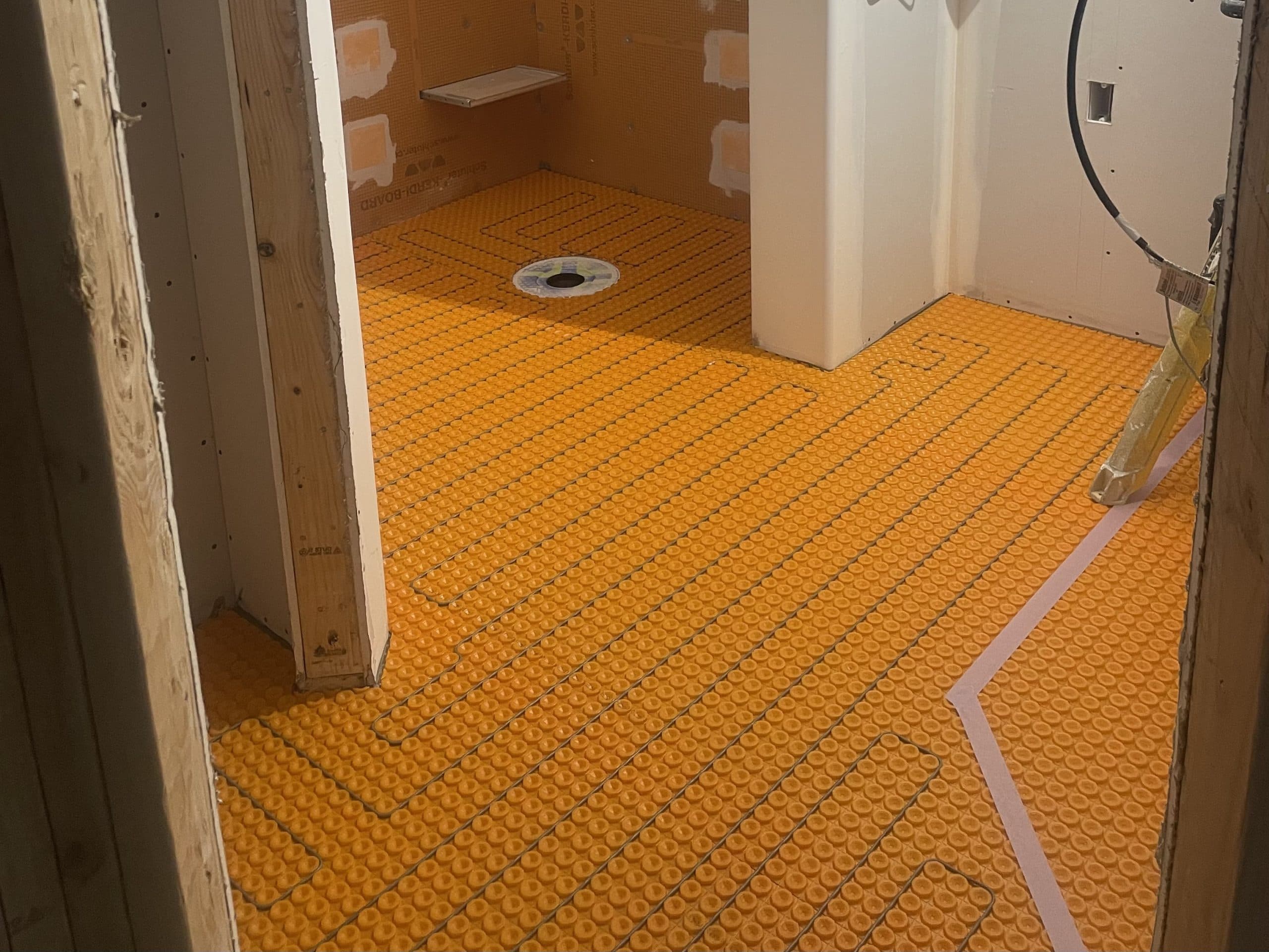 Radiant heated floor system being installed in Sacramento bathroom renovation